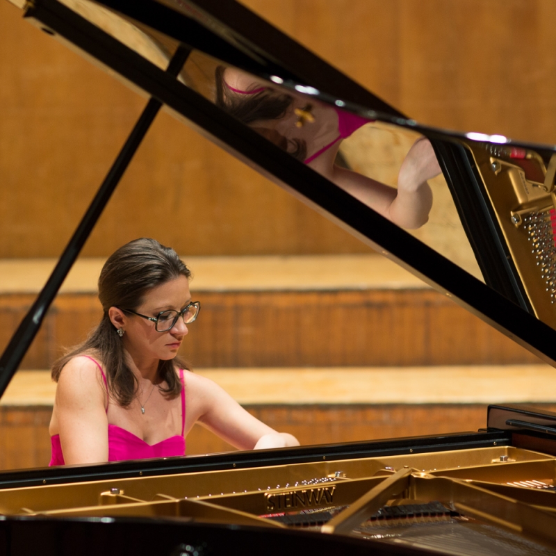 Yllka teaching a student at a Steinway grand piano